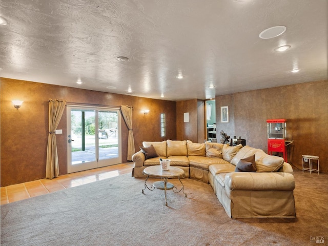 living area featuring light tile patterned floors and light colored carpet