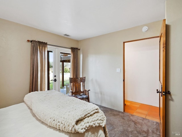 bedroom with access to exterior, carpet, visible vents, and french doors