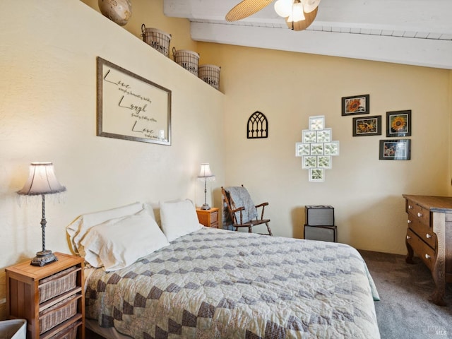 bedroom with lofted ceiling with beams and carpet floors