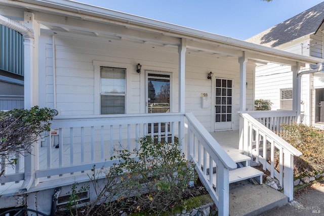 property entrance featuring covered porch