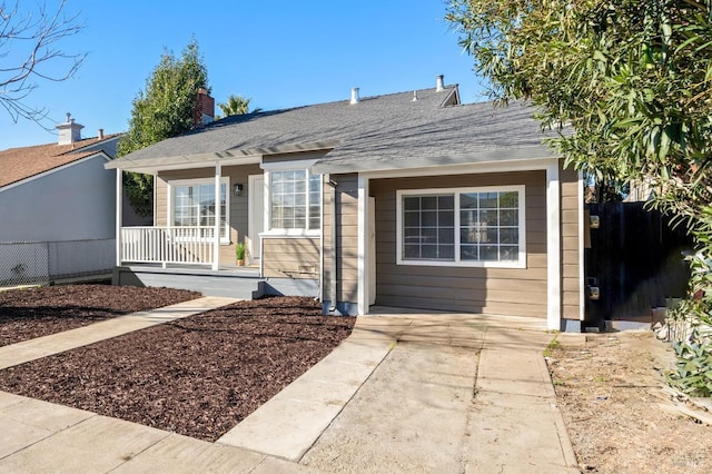 ranch-style home with a porch