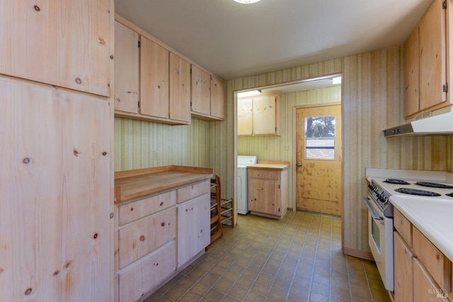 kitchen with under cabinet range hood, light countertops, electric range oven, washer / clothes dryer, and wallpapered walls