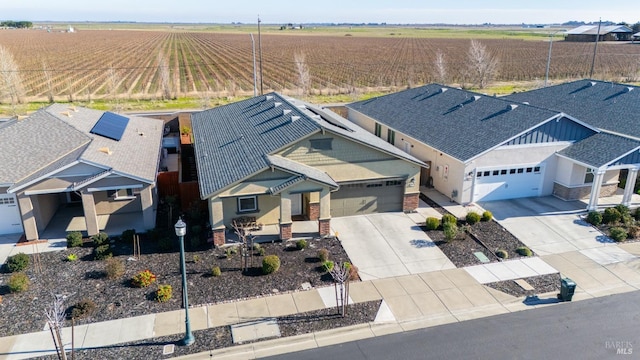 birds eye view of property with a rural view