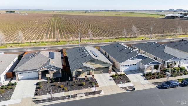 birds eye view of property with a rural view