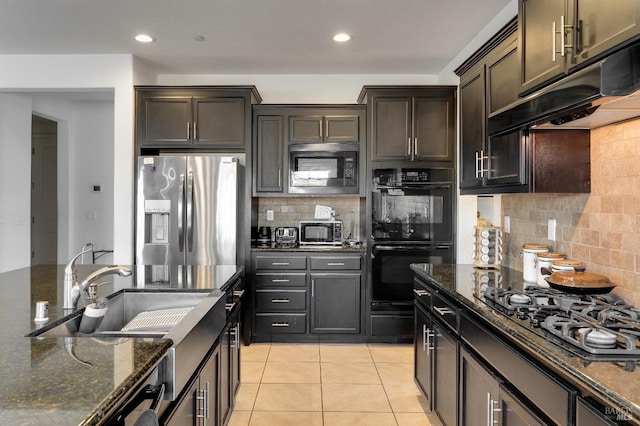 kitchen with built in microwave, gas cooktop, stainless steel refrigerator with ice dispenser, double oven, and exhaust hood