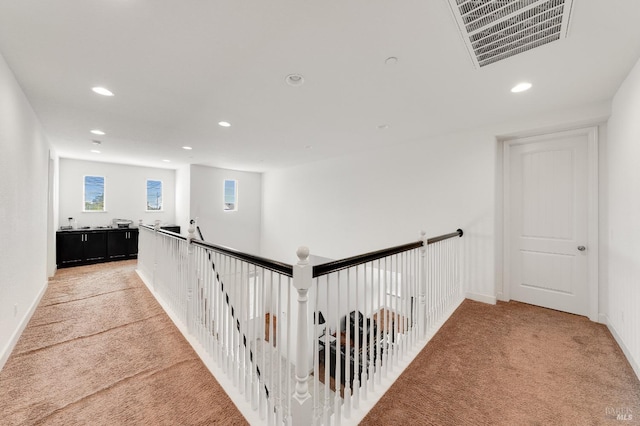 hallway featuring carpet