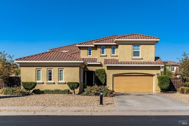 mediterranean / spanish-style home featuring a garage