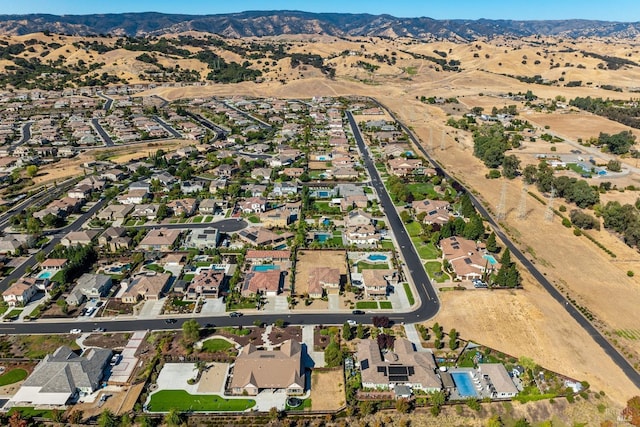 birds eye view of property with a mountain view