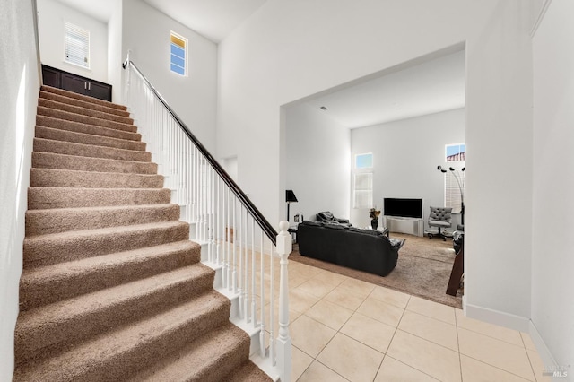 stairway featuring tile patterned floors