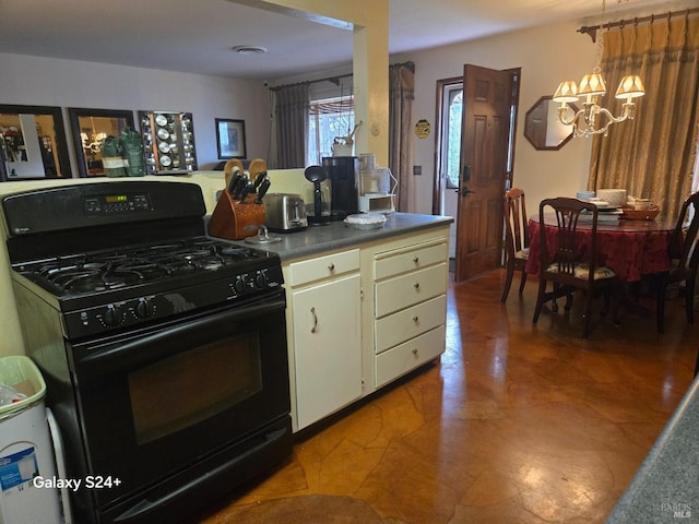 kitchen with a notable chandelier and black range with gas stovetop