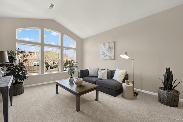 living room with light carpet, vaulted ceiling, and a notable chandelier