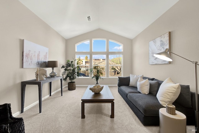 carpeted living room with lofted ceiling