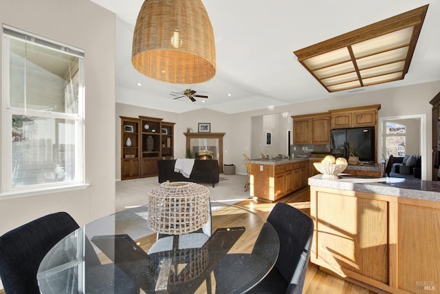 dining area featuring ceiling fan and light hardwood / wood-style floors