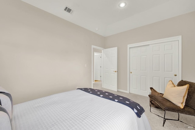 carpeted bedroom with a closet