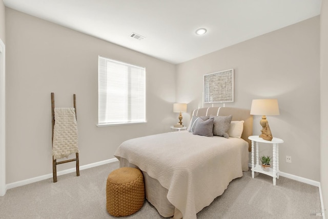 bedroom with light carpet