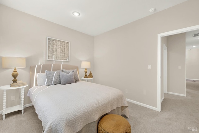 hallway with light colored carpet