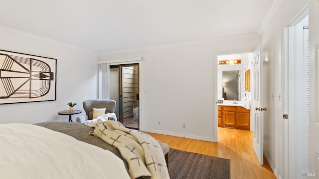bedroom featuring ensuite bathroom, crown molding, and light hardwood / wood-style flooring