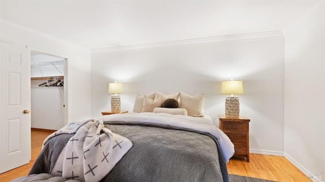 1791 Silverado Trl Unit 5, Napa, CA 94558 - bedroom with crown molding, light wood-style floors, a spacious closet, baseboards, and a closet