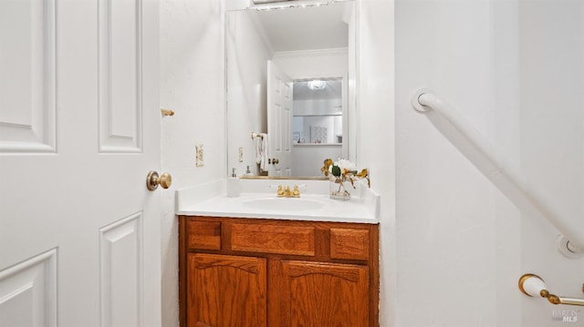 bathroom featuring vanity and crown molding