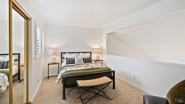 bedroom featuring light colored carpet