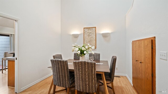 dining room with light hardwood / wood-style flooring