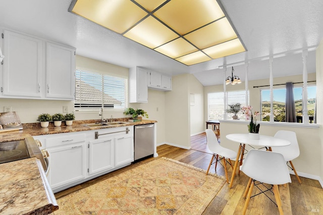 kitchen with white cabinets, dishwasher, and sink