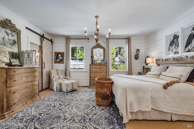 bedroom with crown molding, an inviting chandelier, and a barn door