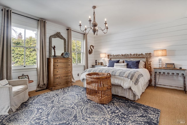 bedroom with a chandelier and multiple windows