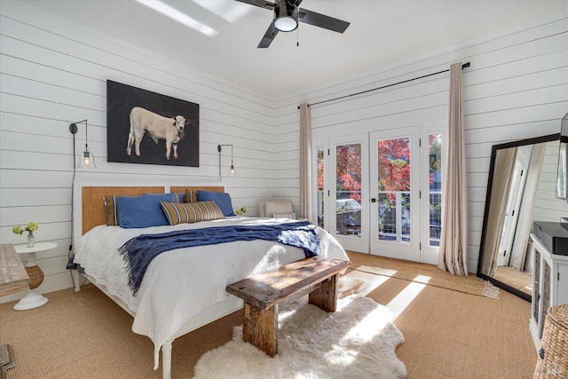 carpeted bedroom with access to exterior, ceiling fan, and french doors