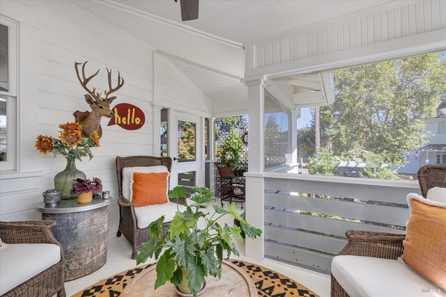 kitchen featuring hanging light fixtures, white cabinetry, high end appliances, and sink