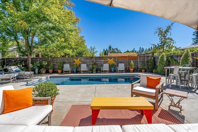 view of pool with a fenced in pool, a patio area, and a fenced backyard