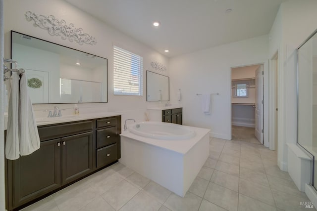 bathroom featuring tile patterned floors, vanity, and an enclosed shower