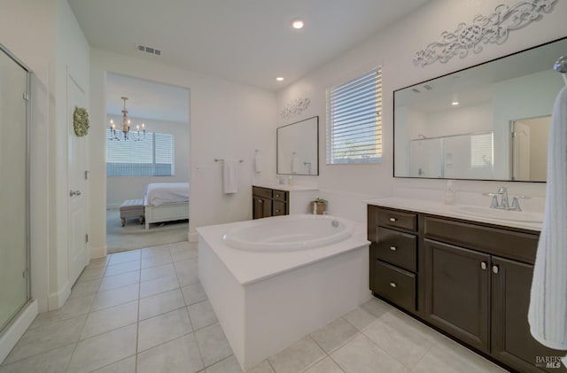 bathroom featuring tile patterned floors, an enclosed shower, and plenty of natural light