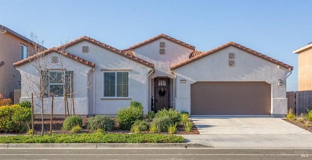 mediterranean / spanish-style home featuring a garage