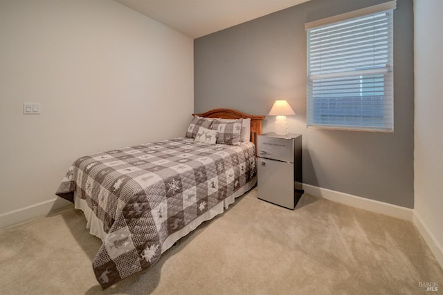 bedroom with light colored carpet