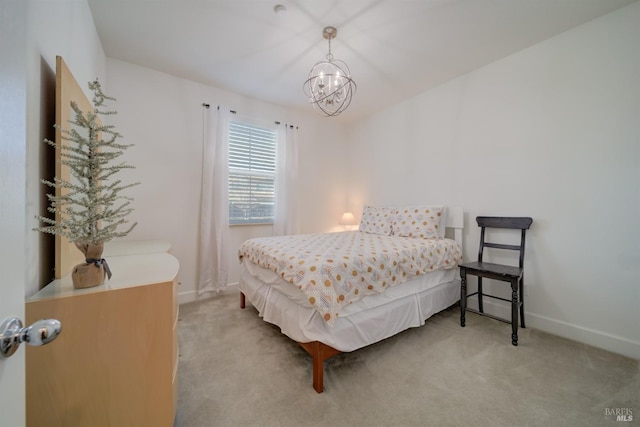 carpeted bedroom with a chandelier