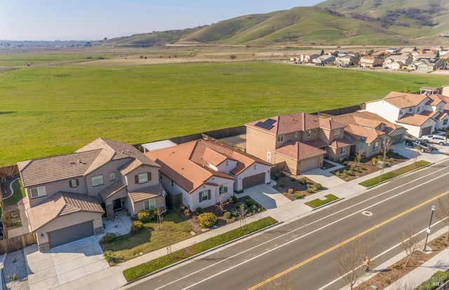 bird's eye view with a mountain view and a rural view