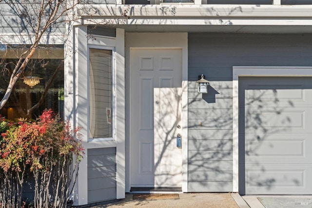 view of exterior entry featuring a garage