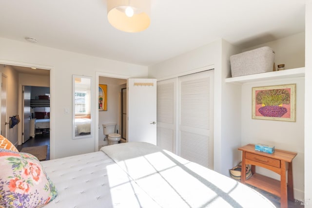 bedroom with ensuite bathroom and a closet