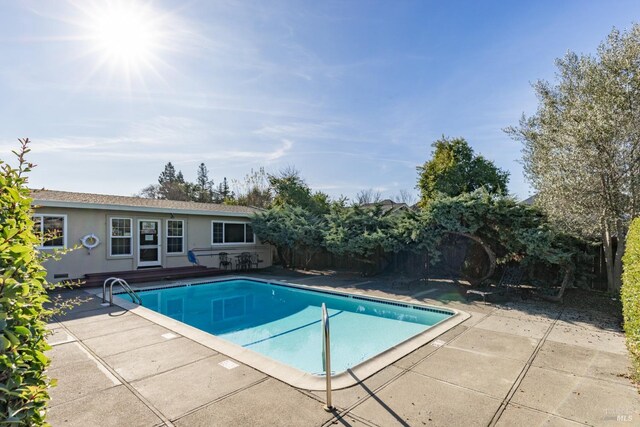 view of swimming pool with a patio area