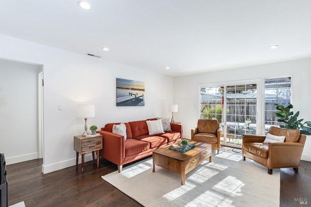 living room featuring dark hardwood / wood-style flooring