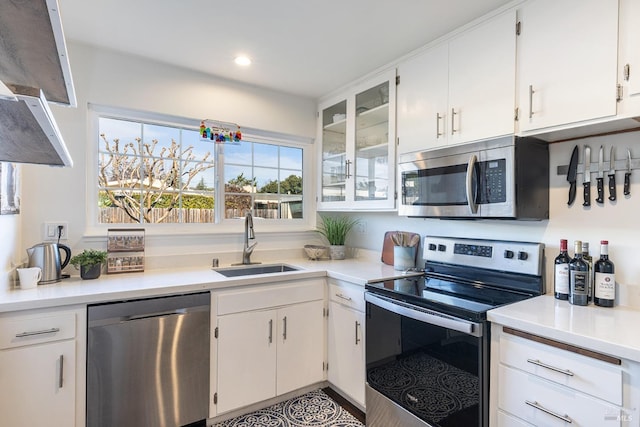 kitchen with white cabinets, sink, and stainless steel appliances