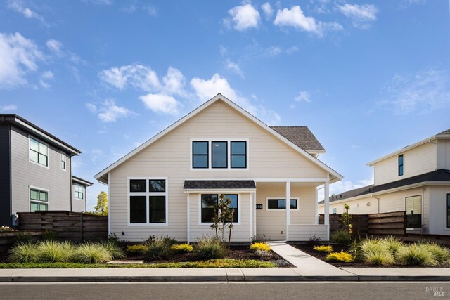 view of front of house with fence