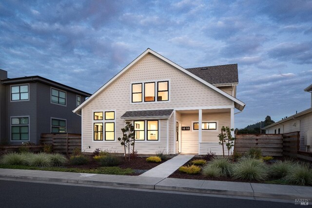 view of front of home with fence