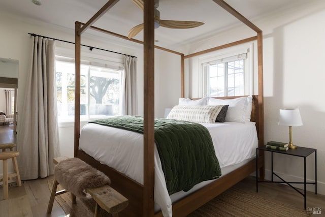 bedroom featuring wood-type flooring and ceiling fan