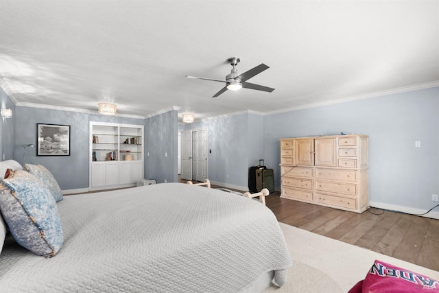 bedroom with ceiling fan, crown molding, and hardwood / wood-style floors