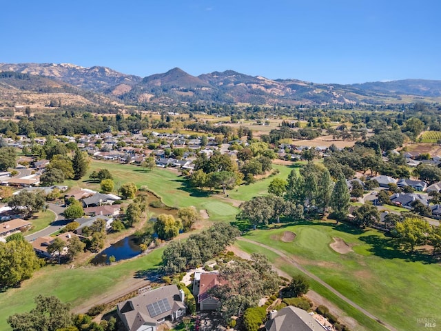 drone / aerial view with a water and mountain view