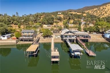 view of dock featuring a water and mountain view