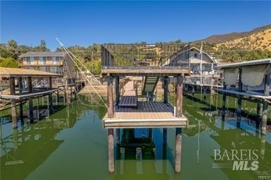 dock area featuring a water and mountain view