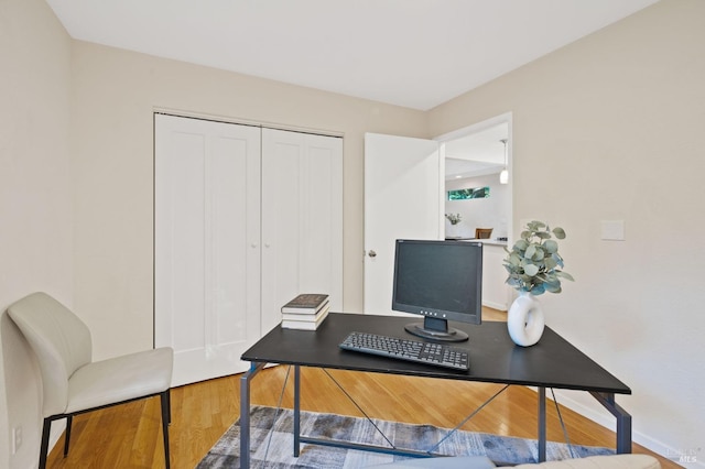 home office featuring hardwood / wood-style floors